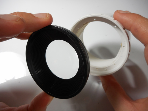 Image 2/2: The outer lens is now free and ready for replacement.