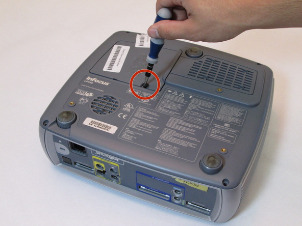 Image 2/2: Remove the black 7mm screw on the external case with a Phillips 2 screwdriver.