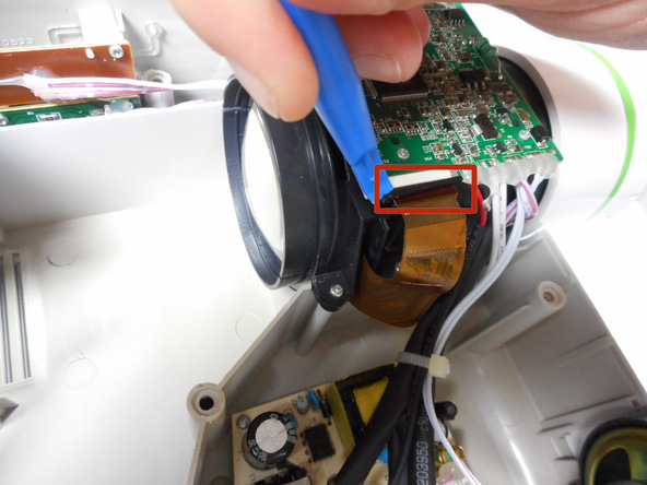 Image 1/2: Once the ribbon cable is disengaged gently pull the cable off the motherboard.