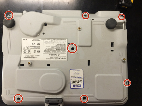 Image 1/3: Remove 5 screws from back panel. These are all the same as well (not the same as the ones on the bottom).